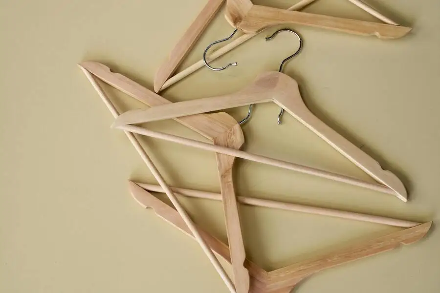  Wooden clothes hangers on a surface