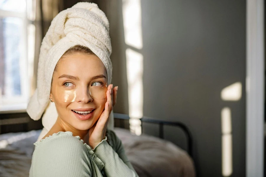 a woman with eye masks smiling