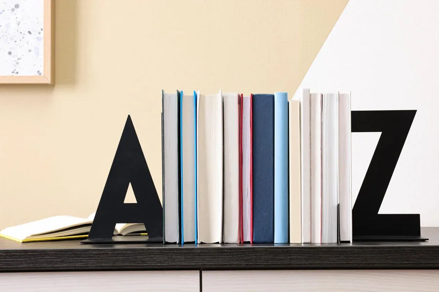 alphabet modern bookends on a wooden desk