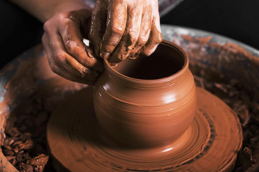 an artisan making a flower pot