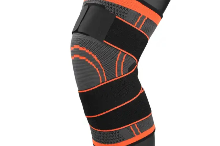 Compression knee brace with adjustable strap