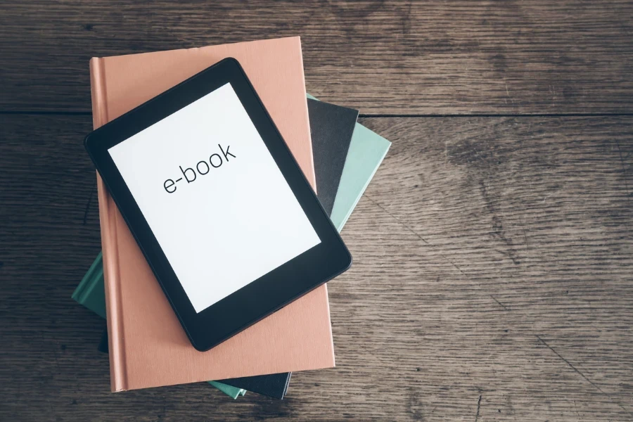 E-reader on a stack of books