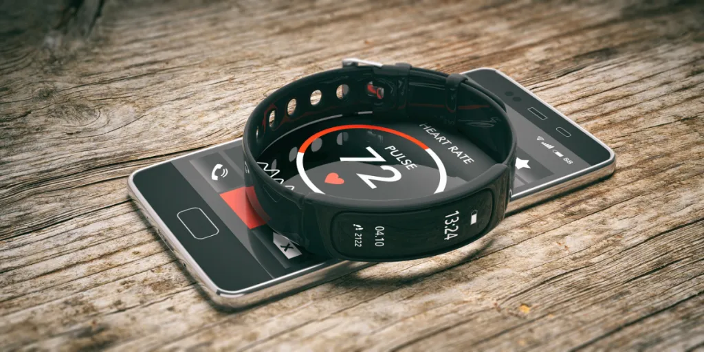 Fitness tracker on top of a smartphone