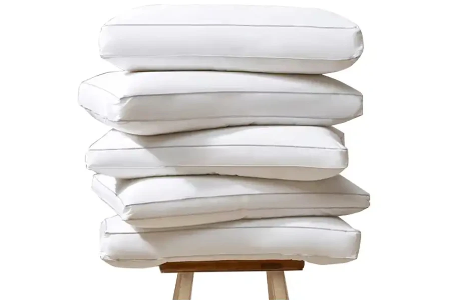 Five well-sewn down alternative pillow inners on a table