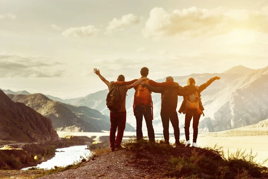 happy friends go hiking together