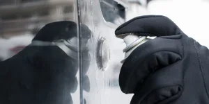 Closeup of man hand with lock door de-icer