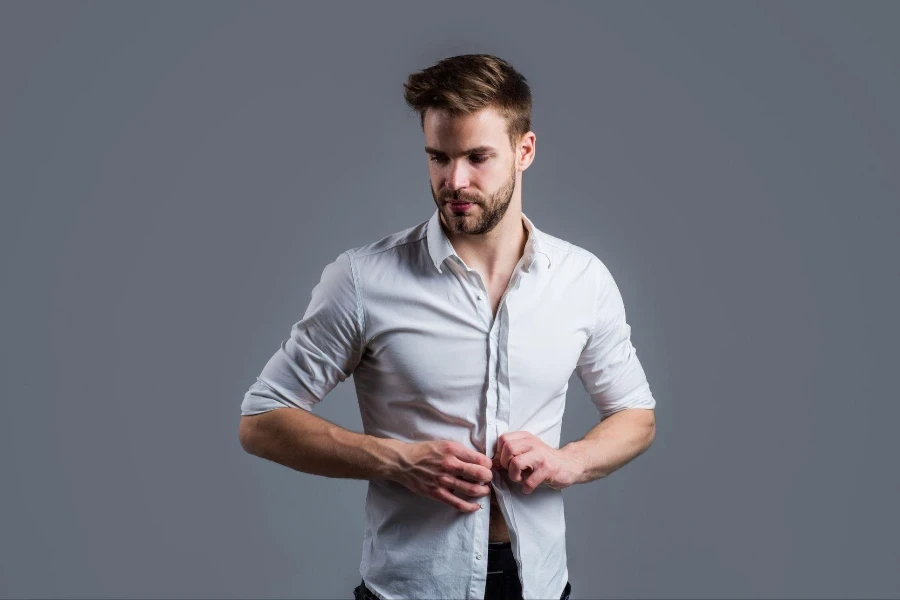 young handsome man in formal wear has bristle on face