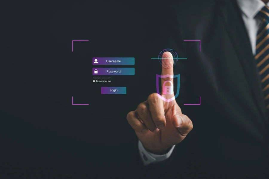 Pointing finger on a futuristic biometric identification fingerprint scanner.