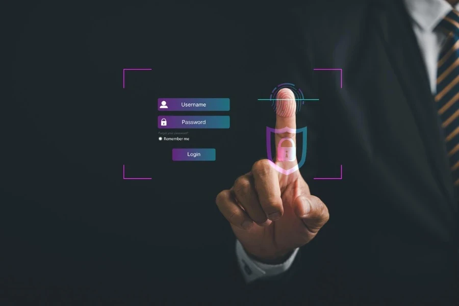 Pointing finger on a futuristic biometric identification fingerprint scanner.