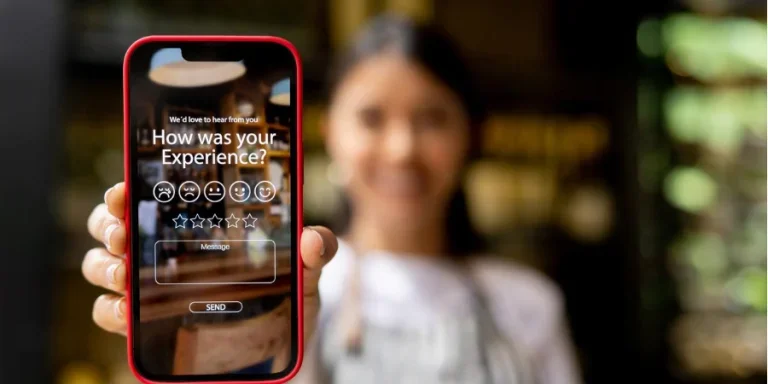 Waitress displaying an app to rate your experience at a restaurant