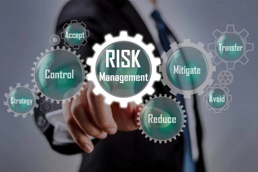 Businessman pointing at risk management concept on screen