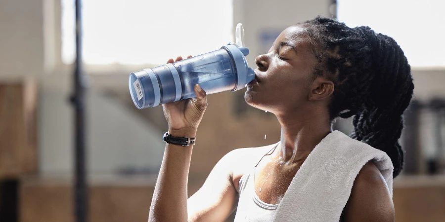 Drinking water and relax after a fitness