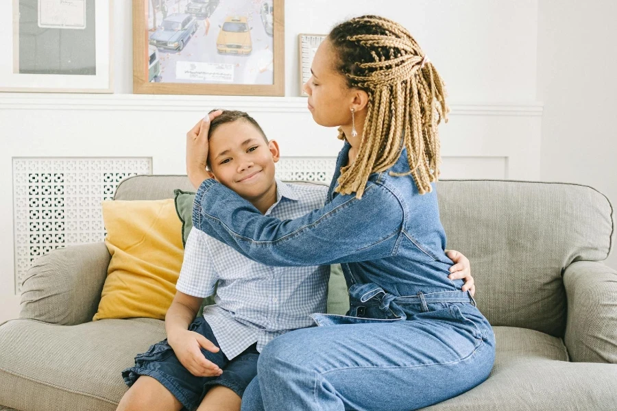 A Mother and Son Sitting on a Couch