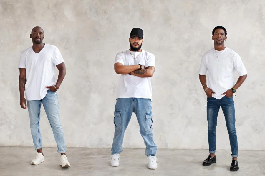Collage of three different men full body against textured gray wall, dressed in jeans and white T-shirts