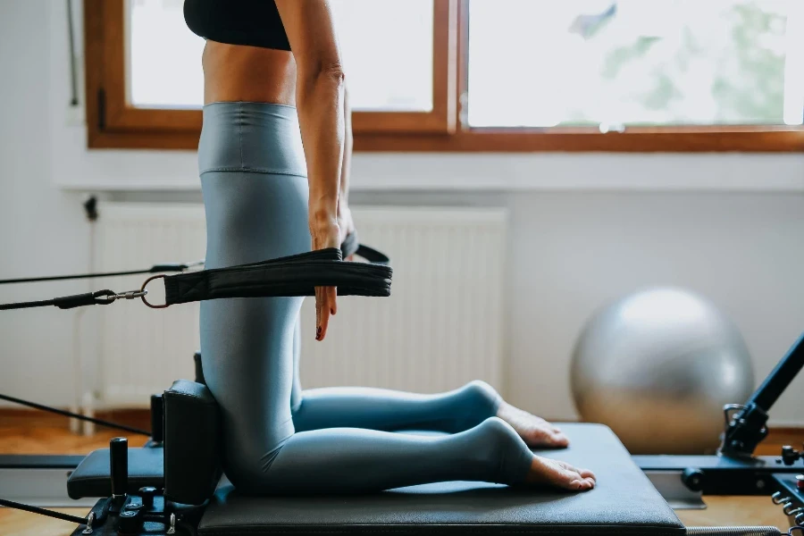 young sporty attractive woman practicing Pilates