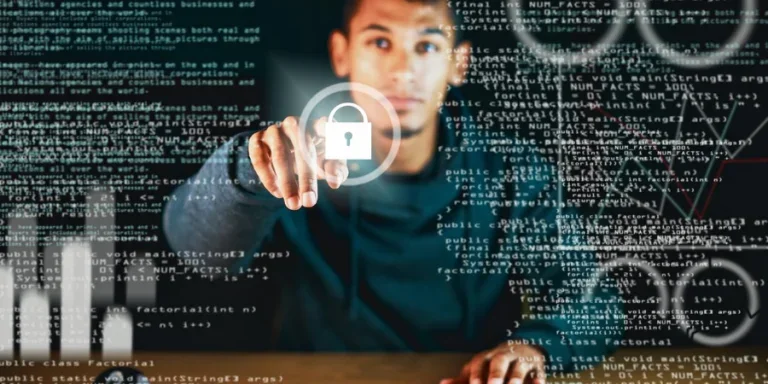 A young man looks towards camera at a transparent interactive screen