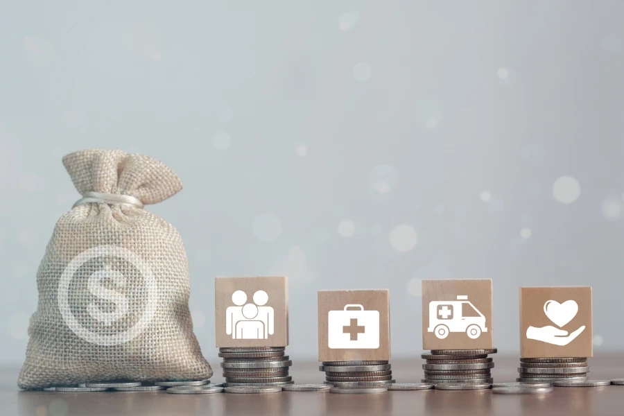 Money coin and wood block stacking with icon healthcare medical