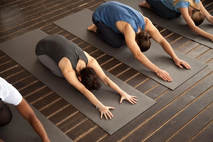 young sporty Americans practicing yoga