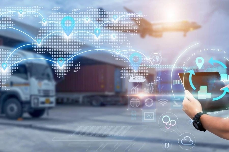 Man hands using tablet on blurred Distribution Warehouse and Freight Truck