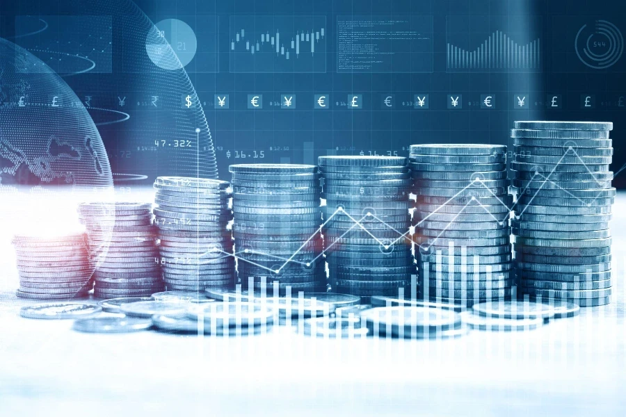 Stack of money coin with trading graph for finance investor.