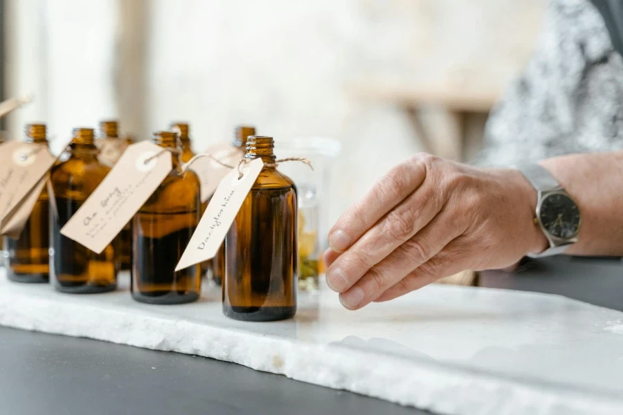 man reaching perfume bottles