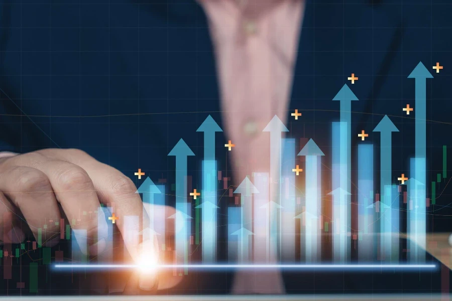 Business man point plan growth increase of positive indicators graph in his business