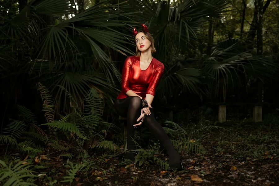Woman in a Devil Costume Posing in the Forest