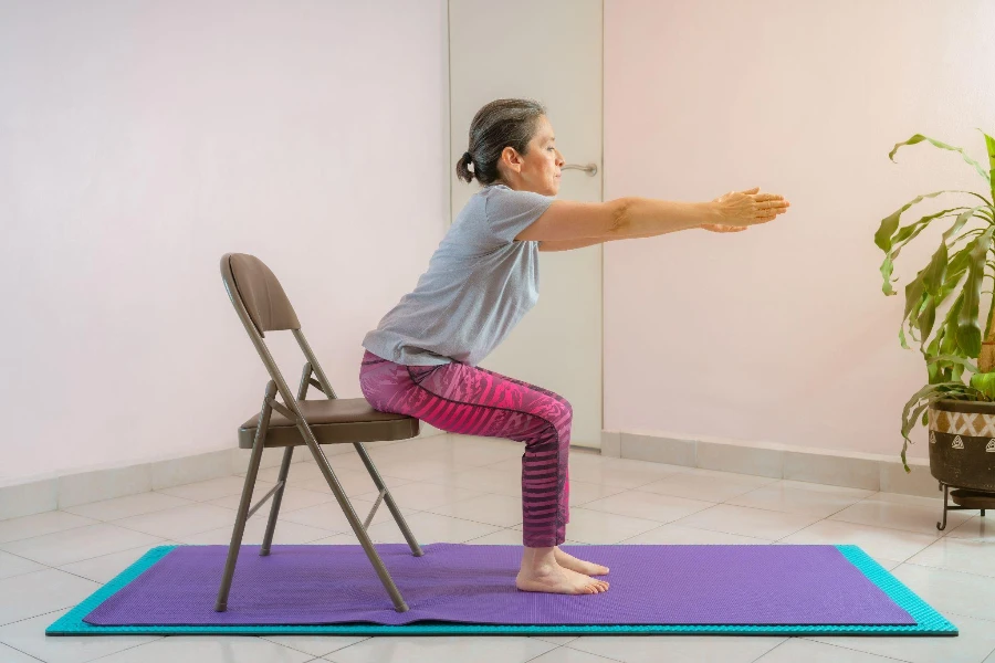 energetic mature woman making exercising and practicing yoga