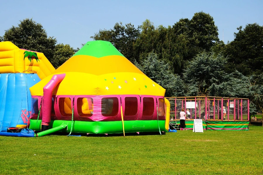 Bouncy castle and enclosed play area in the park