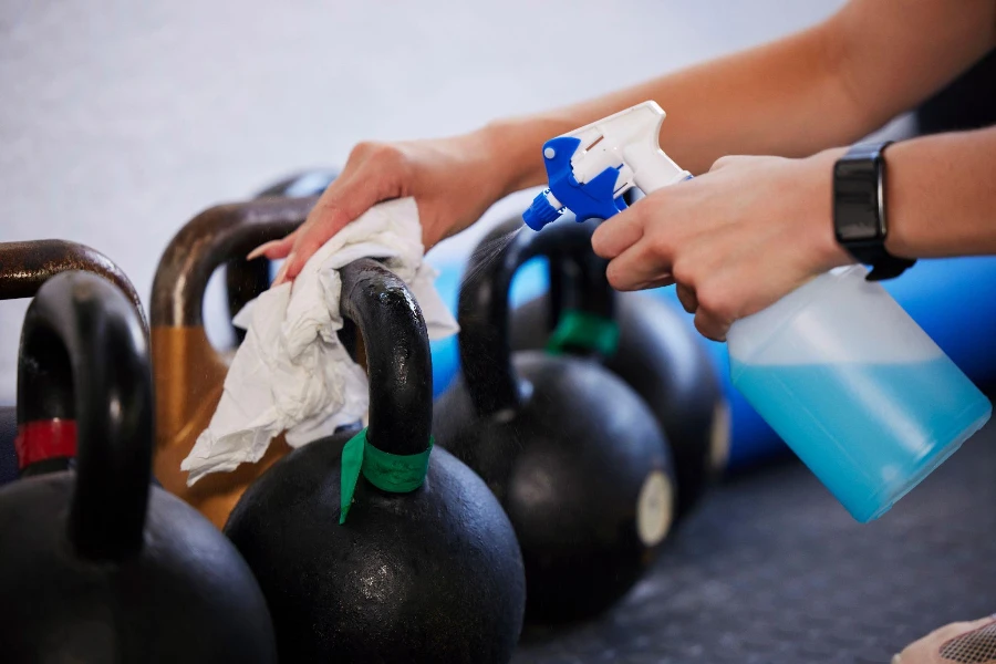 hygiene and hands cleaning kettlebell with cloth and spray bottle