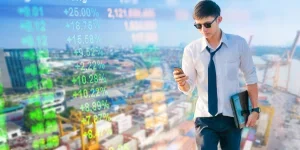 Business analysis stock market with digital tablet skyscaper background