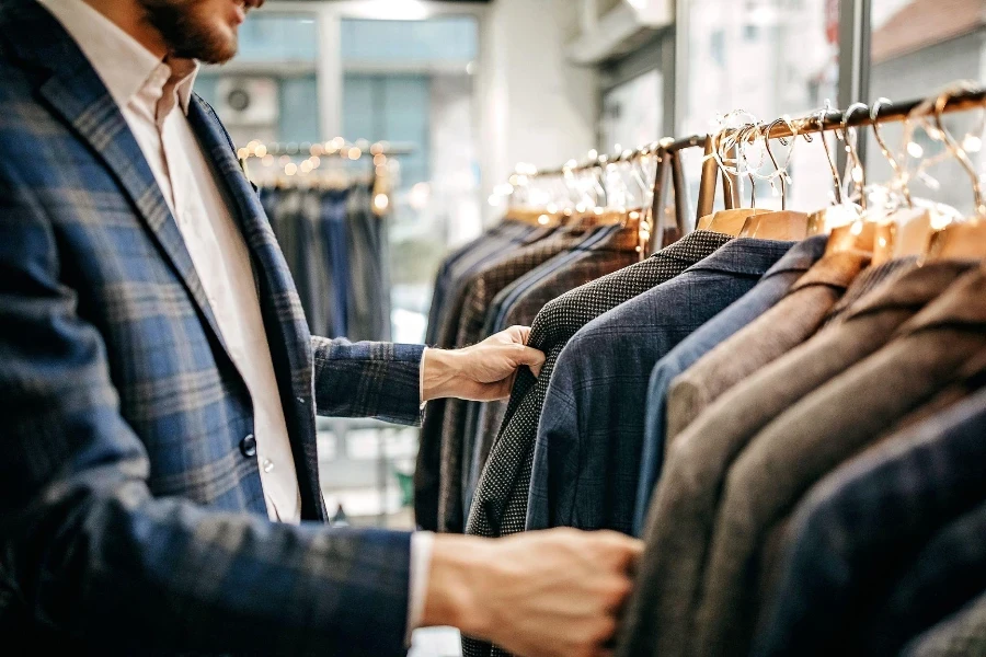 Businessman trying suit in store