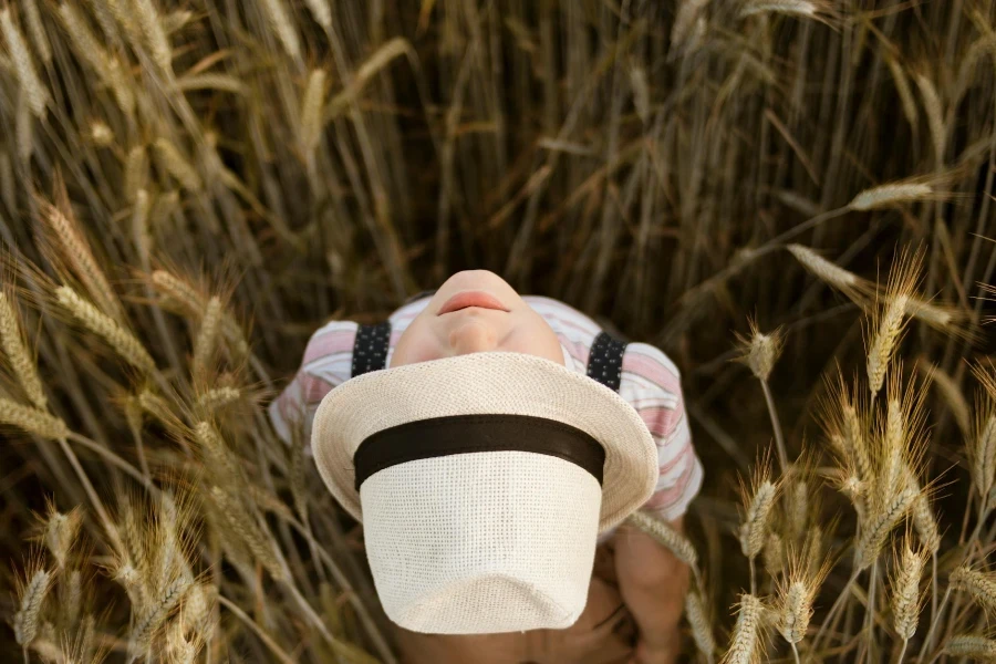 Photo of a Person Wearing White Fedora Hat