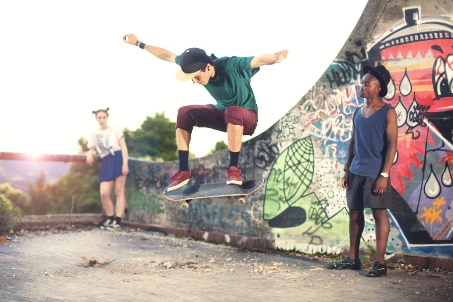 Skater in movement making a trick with his skate with friends