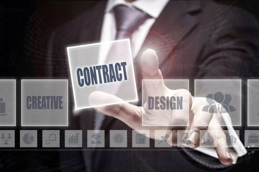 Businessman pressing an Contract concept button.