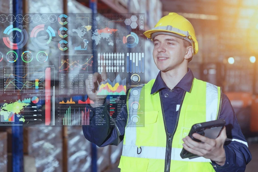 Warehouse worker using hologram visual smart information display for futuristic data business intelligent for Logistics Industry