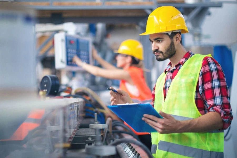 Portraits of workers in PVC factory.