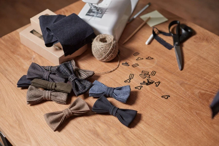 Bow ties made of wool on oak wooden table