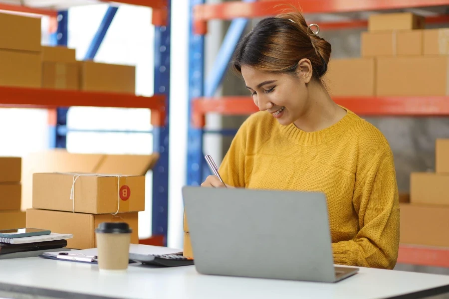 Woman who start up small business works in a warehouse