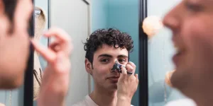 the man is cleaning the T-zone