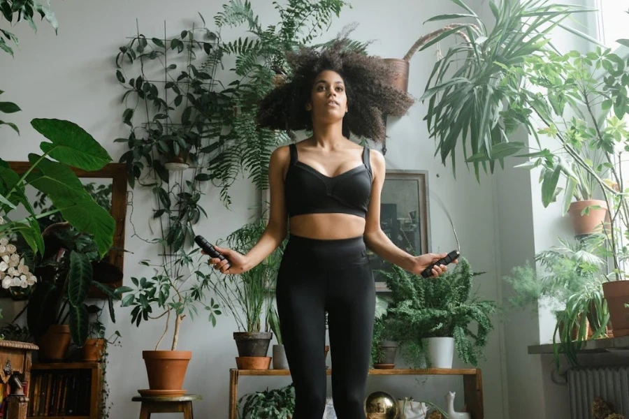 Woman jumping rope at home