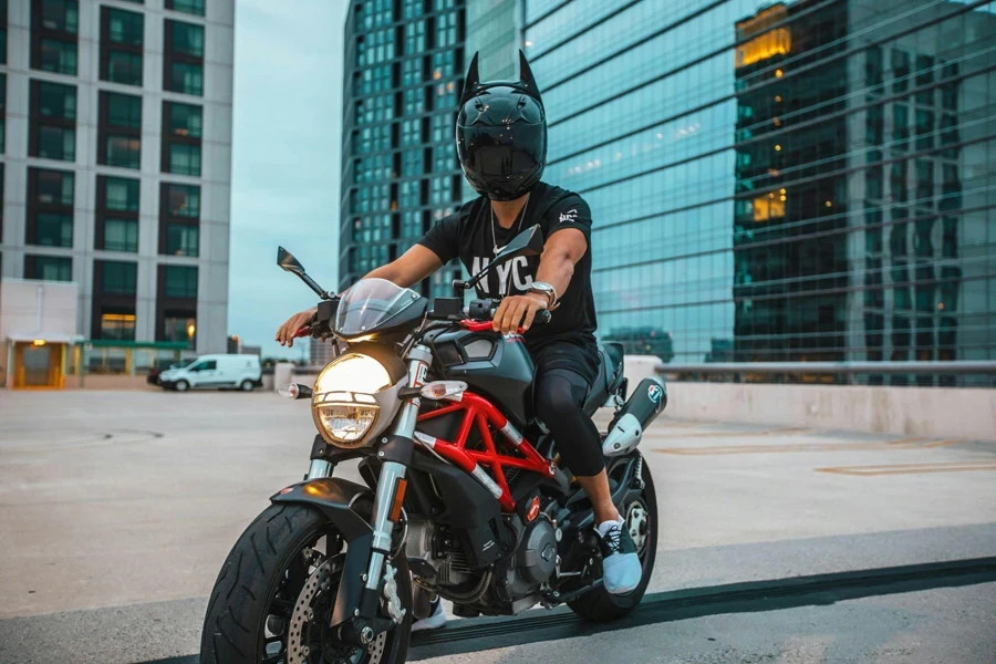 A Person Wearing a Helmet Riding a Motorcycle