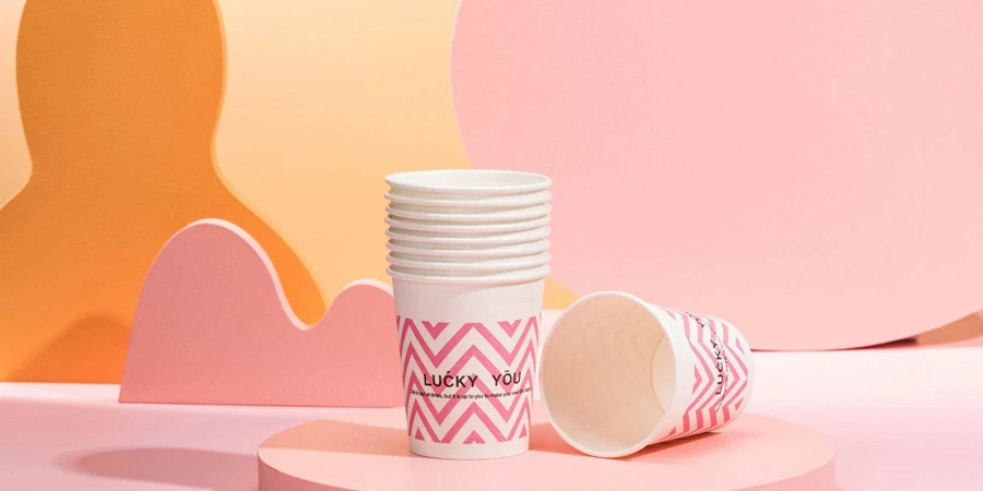 A Stack of White Cups on a Pink Stand