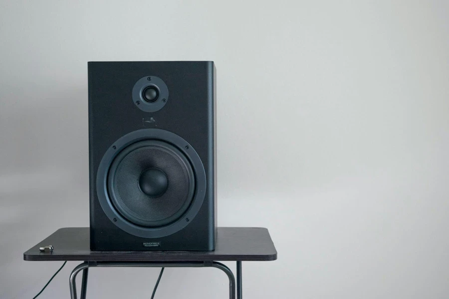 A Tabletop With a Speaker Positioned on It