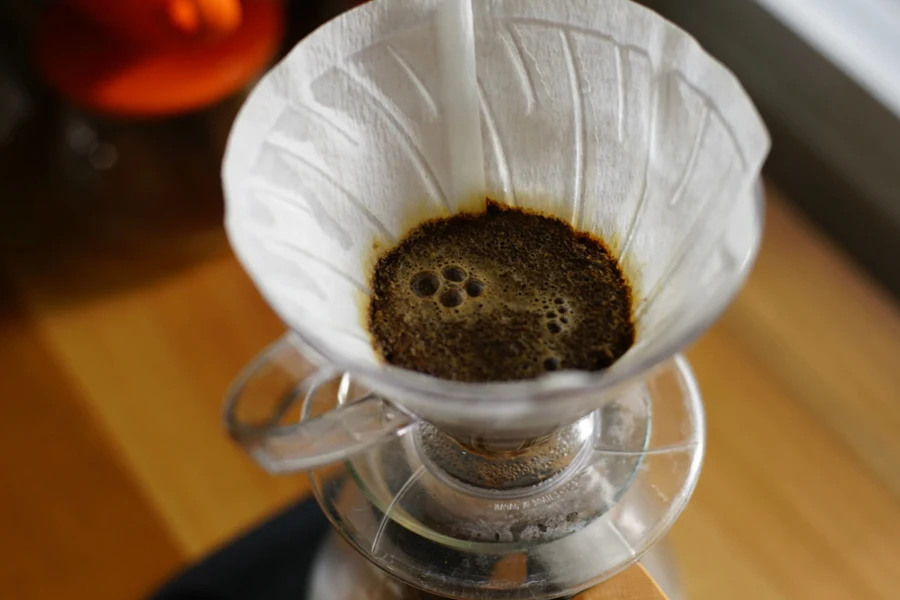 A coffee filter resting on a glass jug