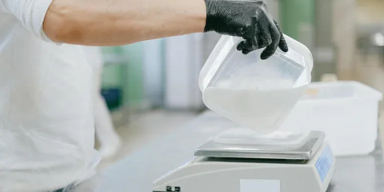 A cook using measuring cooking tool