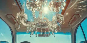 A crystal chandelier hanging from the ceiling of an electric car