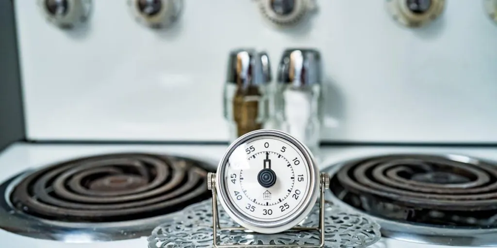 A kitchen timer on a stovetop