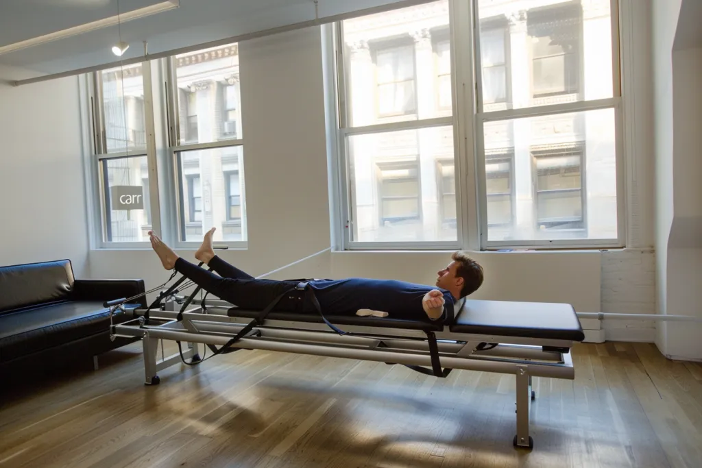 A man is doing the pilates