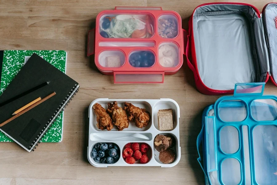 A set of lunch boxes with food